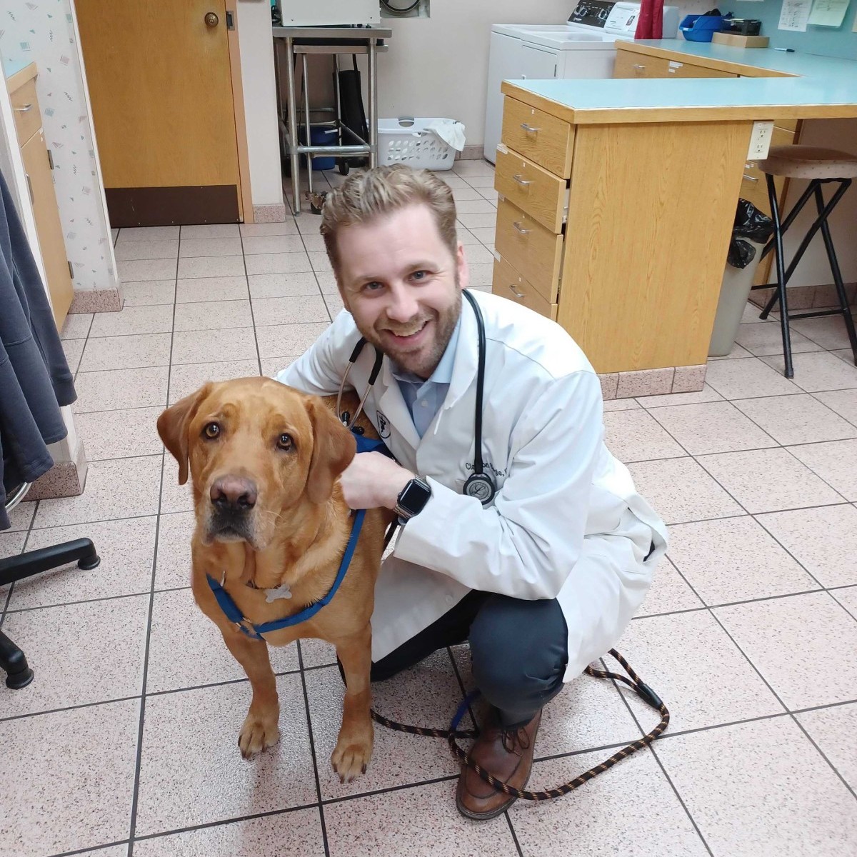 Dr. Siegle poses with Morgan after Morgan's TPLO surgery.