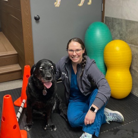 Veterinary rehabilitation nurse Emily Harkness with a loyal client, Colby