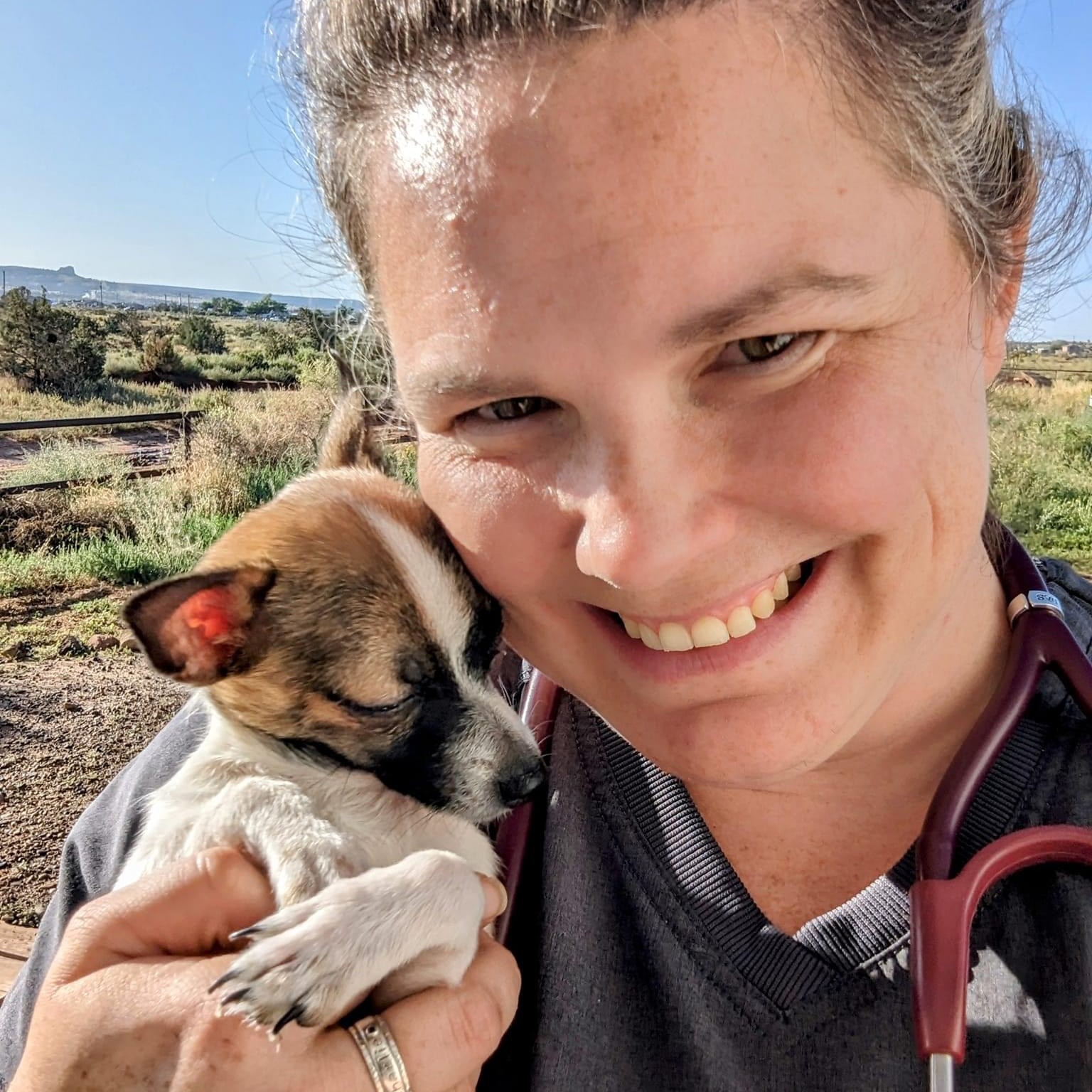 Dr. Solnik snuggles with a patient during her volunteer experience in Arizona for the Parker Project.