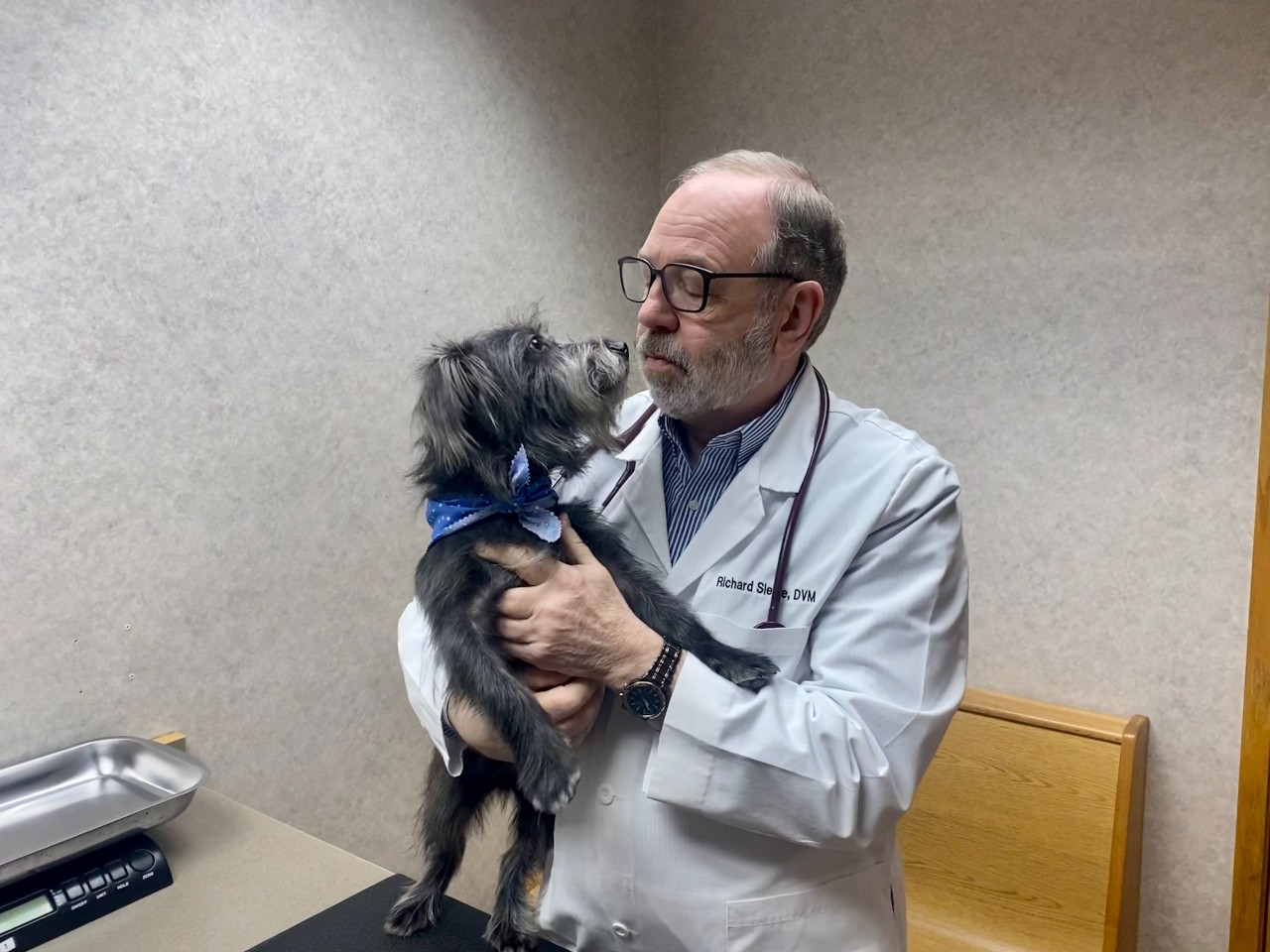 Dr. Siegle and a patient who receives heartworm, flea, and tick prevention year round.