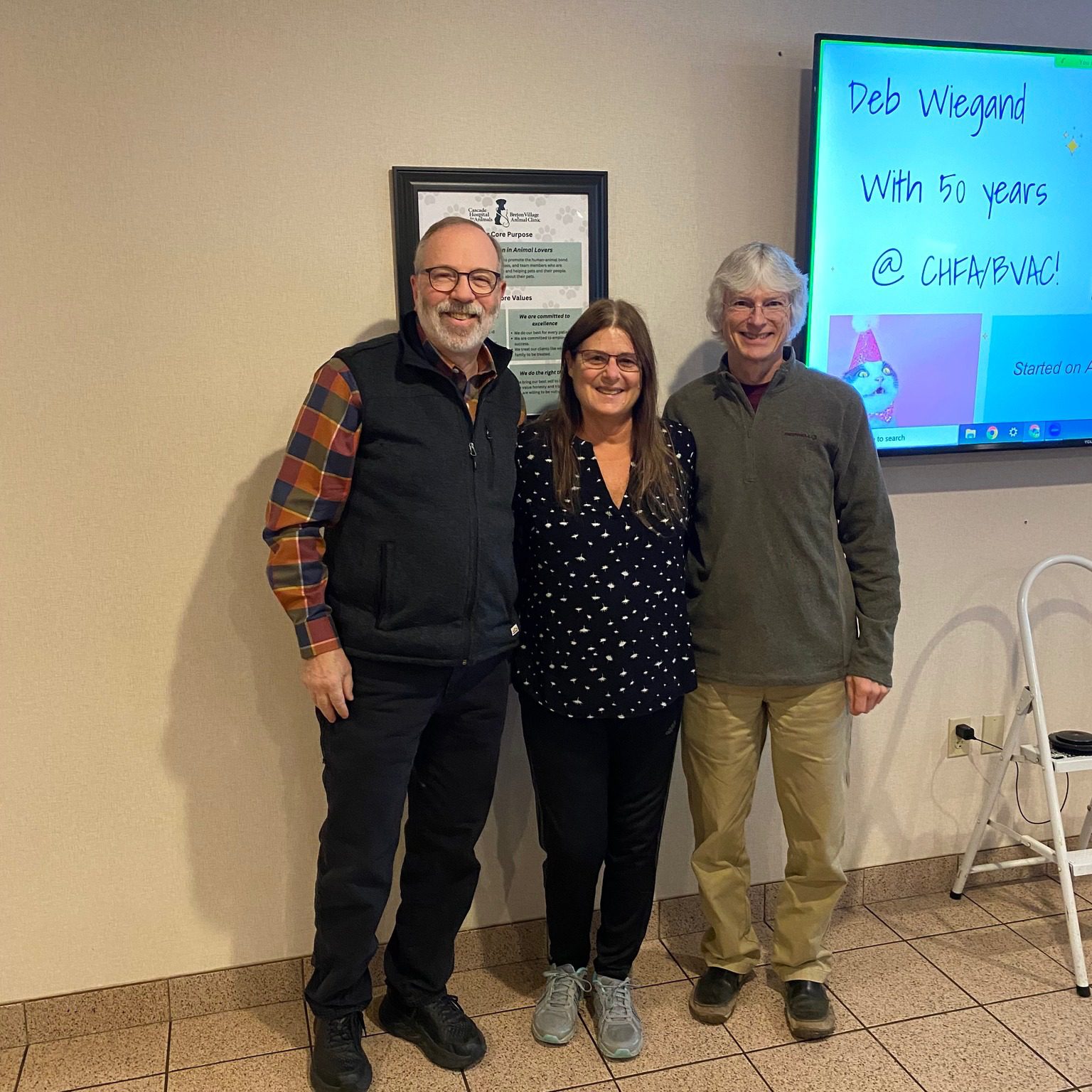 Three People Standing Together For Photo